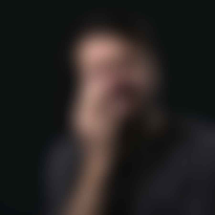 A person holding their cheek in pain, illustrating a toothache with no apparent dental problem